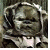 Pixelated image of a character with wrapped head covering and visible teeth, next to text reading 'Ewok Hugger' on black background.