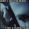A split-screen image with two identical showing a person's face in grayscale, text overlays at top and bottom reading "WHEN I GOT THE MUSIC" and "...I GOT A PLACE TO GO"