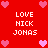 Red background with pink heart icons and repeated white text reading LOVE NICK JONAS in a pattern