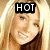 A pixelated image of a smiling woman with long blonde hair, featuring text overlays that change from 'HOT' to 'STUFF'.