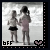 Two children stand on a beach; one child in pink dress and black shorts holds the other's hand while both face left, with 'bff' text and heart symbol below.