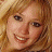 A pixelated image of a smiling person with light brown hair on the left, next to green text reading 'Original Icons .com' on a dark green background.
