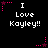 Pixelated text "I Love Kayley!!" on black background with pink star and dot animations.