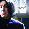 A pixelated close-up of a person with short dark hair wearing a dark turtleneck, with the text 'sex?' visible in the background.