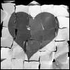 A grayscale heart-shaped icon with a textured, cracked appearance over a fragmented background.