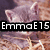 A cat with closed eyes rests on straw, overlaid with text reading 'EmmaE15', 'Loves', and 'Kittens' in black rectangular boxes.