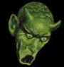 Green-skinned devil head with horns and pointed ears, mouth open in showing purple tongue or lower lip detail against black background