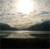Pixelated landscape with bright light source at top center, layered horizontal bands of muted colors, and dark lower section.