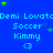 Blue background with repeated text and star symbols in green and gray, showing a static pattern of 'Demi Lovat', 'Soccer Kimmy', and '<3' text elements.