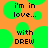 Pixelated text on orange background with green circular shapes, displaying 'i'm in love... with DREW' across multiple