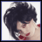 Pixelated image of a person with dark tousled hair, red lips, and visible earrings in the top-left quadrant.