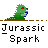 Green dinosaur-like creature with red eyes and blue mouth holds various objects against gray background with "Jurassic Spark" text below.