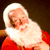 Static pixelated image of Santa Claus with white beard and red suit against dark background.