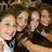 A static image with a bright pink background displays a group photo of five people on the left and green pixelated text on the right.