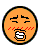 Two side-by-side animated frames of a pixelated orange circular emoji face with black outline, showing subtle facial expression changes between the two frames.