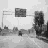 Animated contact sheet of 20 frames showing a grayscale street scene with changing text overlays in various colors.