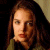 A pixelated image of a person with long brown hair against a dark background, next to green text reading 'Original Icons .com' on a solid green backdrop.