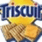 Pixelated image of a yellow cartoon character with a blue 'T' logo above it and brown textured shapes below.