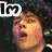 A pixelated image of a person with dark curly hair in three , each showing different text overlays and expressions