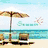 A static beach scene with a white umbrella, two lounge chairs, and turquoise water under a light blue sky.