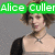 A pixelated image of a woman with short brown hair wearing a black cardigan over a light top and a silver X-shaped necklace, with text overlays.