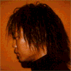 Four- shows a person with dark hair, light hair, and shaved sides across different backgrounds