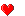 Red pixelated hearts of varying sizes arranged in a on gray background, some with visible internal gaps