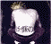 Pixelated image of a person with light hair and dark clothing against a dark background, accompanied by red text reading "RODNEY ROCHA" and "BASS" on separate black