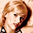Two side-by-side pixelated frames of a woman with light brown hair, one showing her face and upper body in profile, the other showing her smiling while wearing a dark beret.
