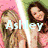 Six display a person with long hair in various poses and backgrounds, each featuring the name 'Ashley' in different colors