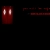 A dark red rectangular shape with two vertical white light patches on the left side, set against a black background.