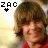 Animated contact sheet of 12 frames showing a young man with brown hair and red shirt, each frame featuring the text "ZAC" above a black heart symbol that changes position relative to gray hearts.