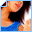 A pixelated image of a person in a blue top with black hair, showing sequential animation frames where symbols appear and change on the chest area.