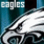 Pixelated image of a white eagle head with blue background and text elements including 'EAGLES' and 'FLY EAGLES FLY'.