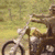 A 50x50 pixel animated contact sheet showing three sequential frames of a stick figure riding a bicycle on grass, with visible animation changes in the figure's arm and leg positions across frames.