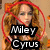 A four- shows a woman with long brown hair in various poses, with overlaid text reading "Miley Cyrus is an idiot" and red prohibition symbols