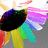A pixelated abstract composition of overlapping colored shapes including black, purple, green, yellow, cyan, red, pink, and blue against a gray background.