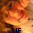 Pixelated orange and brown creature with large eyes, red mouth detail, dark limbs, and blue text 'LIF' at bottom.
