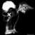 Pixelated grayscale image of a skeletal figure with wings holding a flag, next to text reading 'I AM THE EMO ANGEL' on black background.