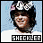 A person wearing a checkered helmet and white shirt appears in with changing background colors, each labeled 'SHECKLER' below