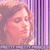 Pixelated image of a person with light brown hair behind vertical purple bars, overlaid with bold pink text reading "TOTAL "