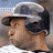 A 4-frame contact sheet of a baseball player in various poses and uniforms, including close-ups of his face and cap with the NY logo.