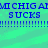 Blue pixelated text on a green background repeats 'MICHIGAMI CHIG AM SUCKS' with multiple exclamation marks below.