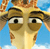 Pixelated close-up of a cartoon giraffe's face with large eyes, brown and tan coloring, and a blue sky background.