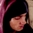 A split-frame contact sheet showing a person's face on the left and pixelated text "When Im Gone" on a blue background on the right, both in low-resolution 48x48 pixels.