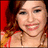 A pixelated close-up of a person with light skin, brown hair, and a red garment, set against a red background with brown and orange tones.