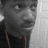 A grayscale animated sequence showing a person's face in four with subtle head and eye movements against a light textured background