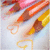 colored pencils with heart-shaped erasers on a light background, featuring subtle animation changes