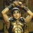 A pixelated figure in golden armor holds a sword above their head against a dark background, with green text reading "Original Icons .com" on the right side.