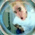 Circular icon shows a person with light hair in a white shirt and dark pants, seated with a blue object in front, against a light blue background with a dark vertical line.